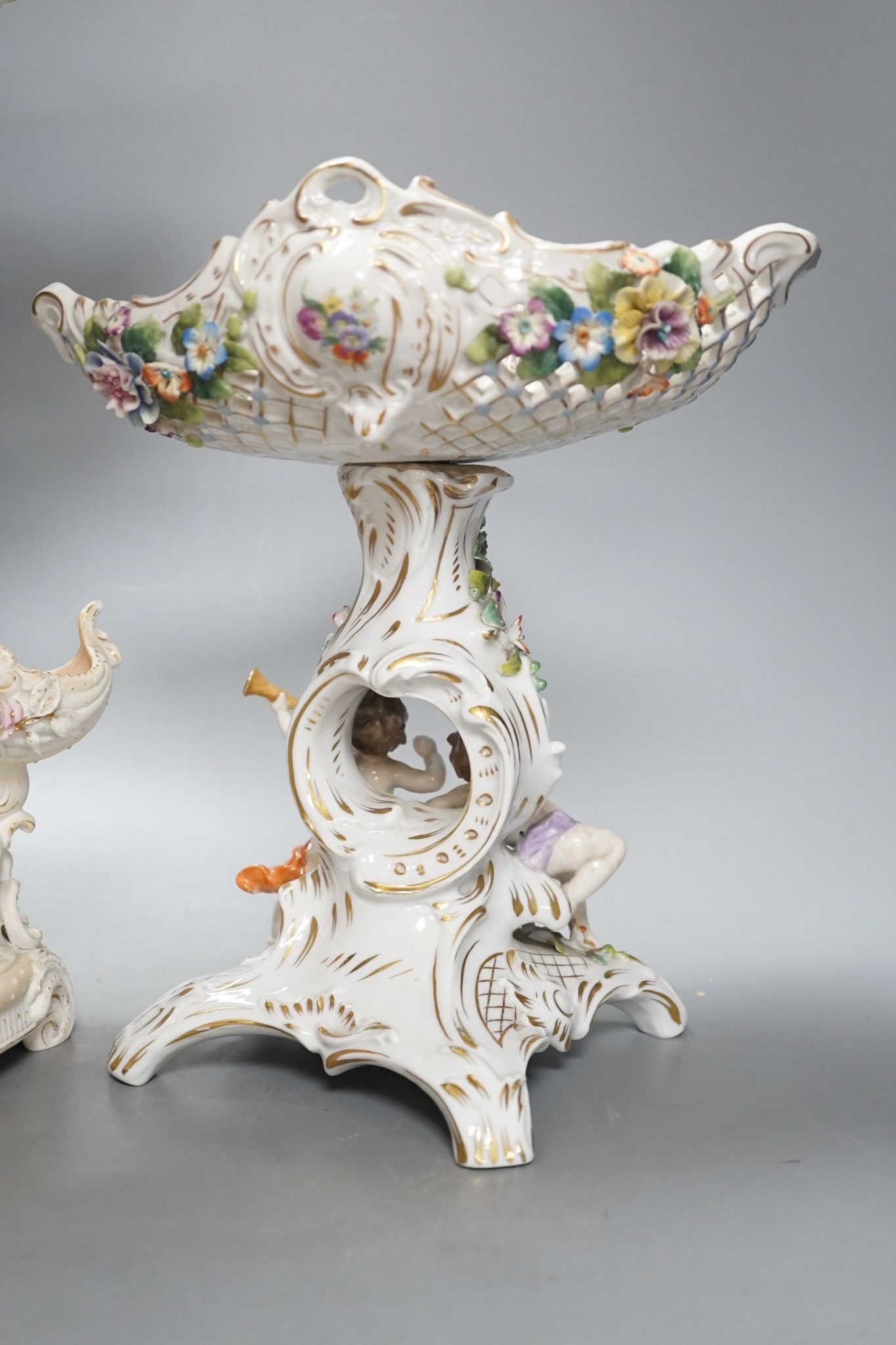 A French bisque centrepiece, Naples porcelain centrepiece and figural chariot, tallest 44cm